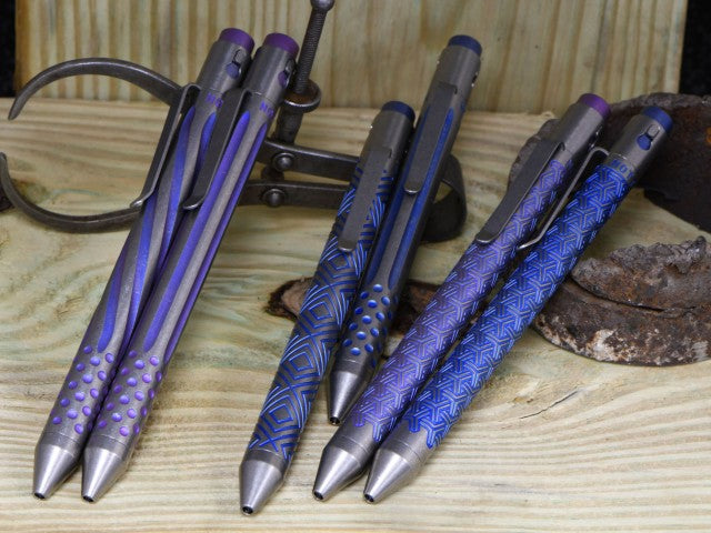 Titanium Custom Anodized Pen group shot in blue and purple - NTI precision tactical pens